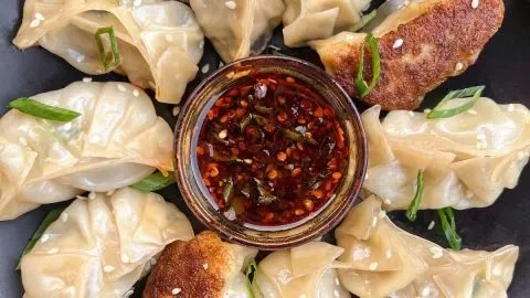 Delicious chicken potstickers cooked to perfection, golden and crispy dumplings.